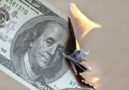 Picture of a burning dollar bill. How to Beat Inflation: A Comprehensive Guide to Smart Investments