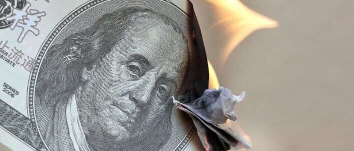 Picture of a burning dollar bill. How to Beat Inflation: A Comprehensive Guide to Smart Investments
