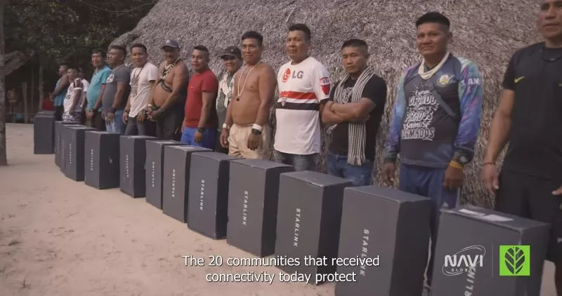 a group of men standing in a line - Amazon Tribe Faces Addiction to Prn and Social Media